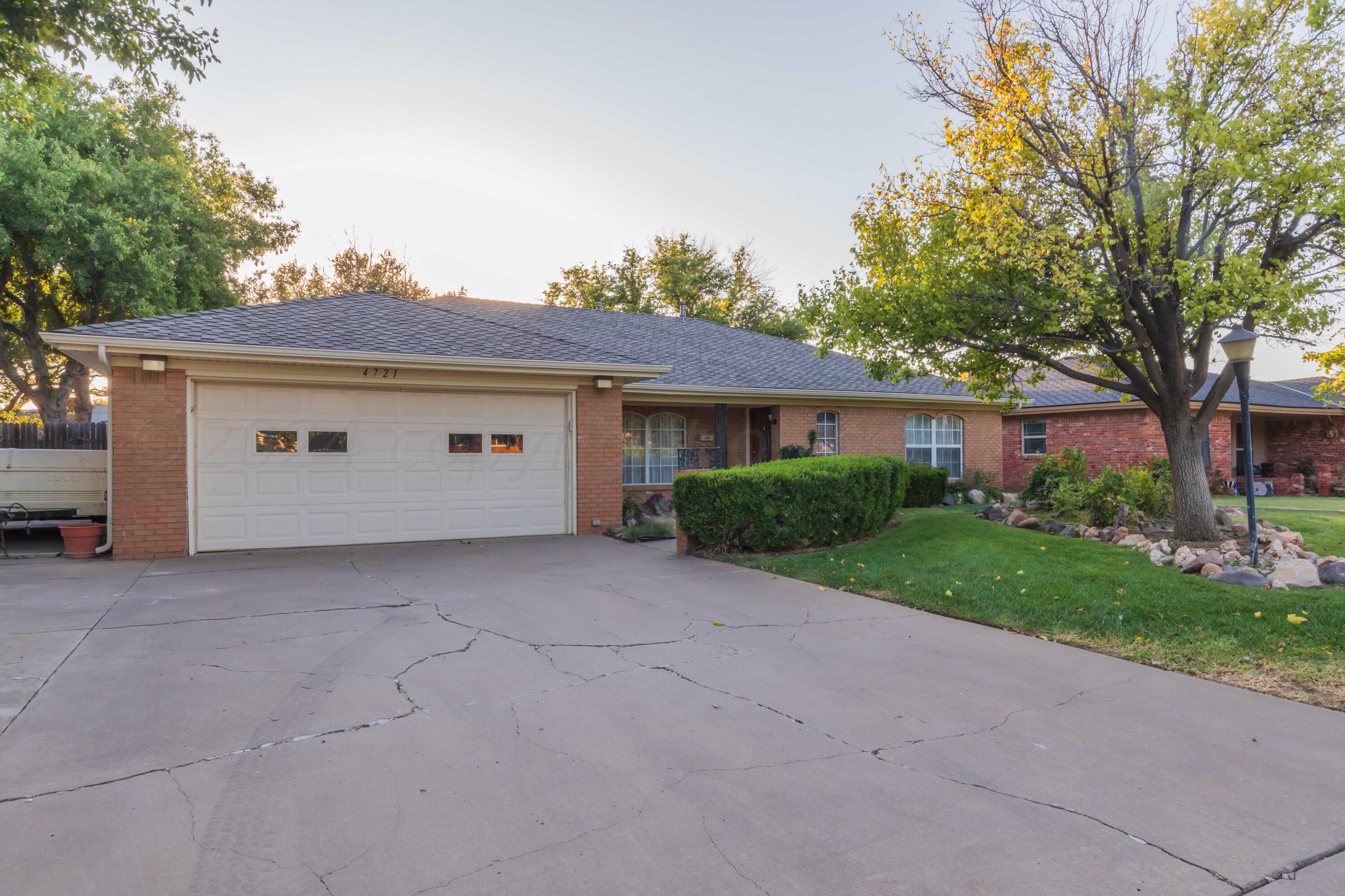 4721 Shawnee Trail Amarillo, TX 79109 - Photo 19 of 52 front view of a house with a yard