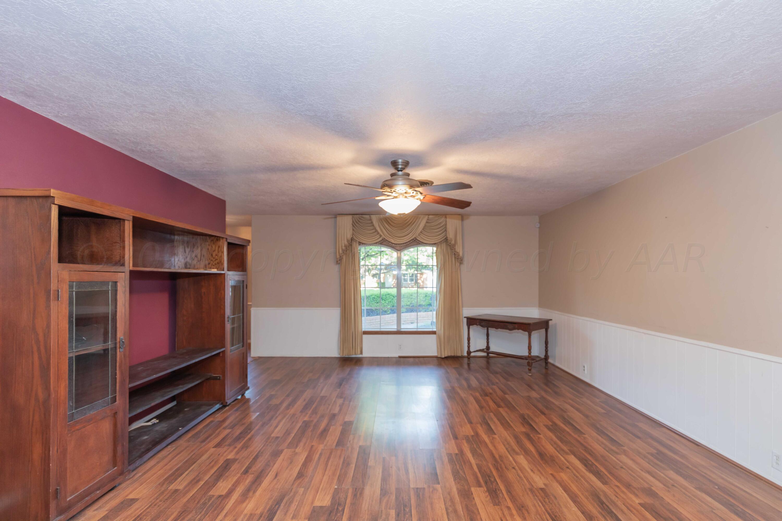 4721 Shawnee Trail Amarillo, TX 79109 - Photo 24 of 52 a view of room with window and wooden floor