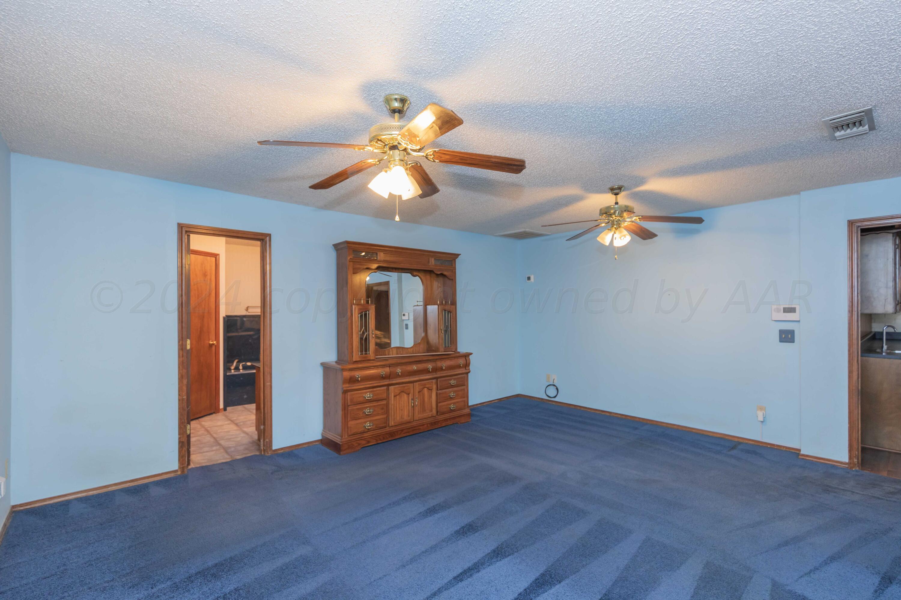4721 Shawnee Trail Amarillo, TX 79109 - Photo 32 of 52 wooden floor in an empty room with a window