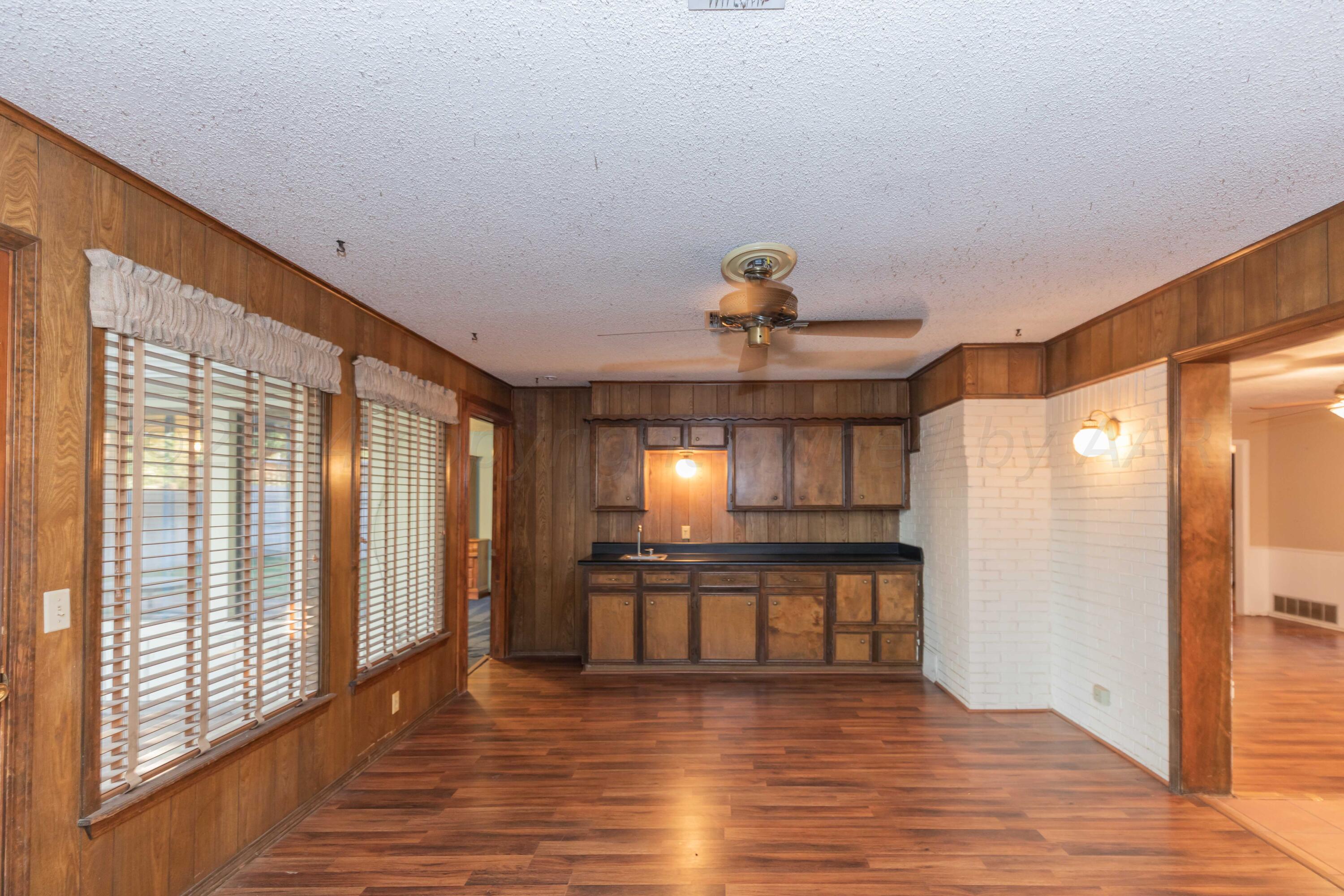 4721 Shawnee Trail Amarillo, TX 79109 - Photo 7 of 52 a view of a kitchen with a sink and a window