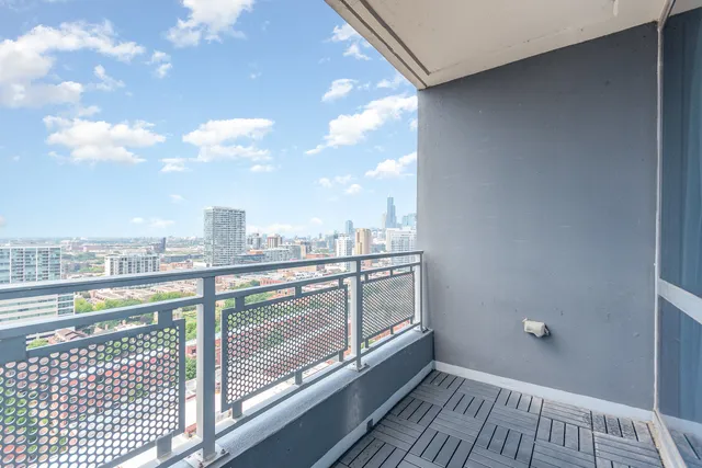 a view of a balcony with city view