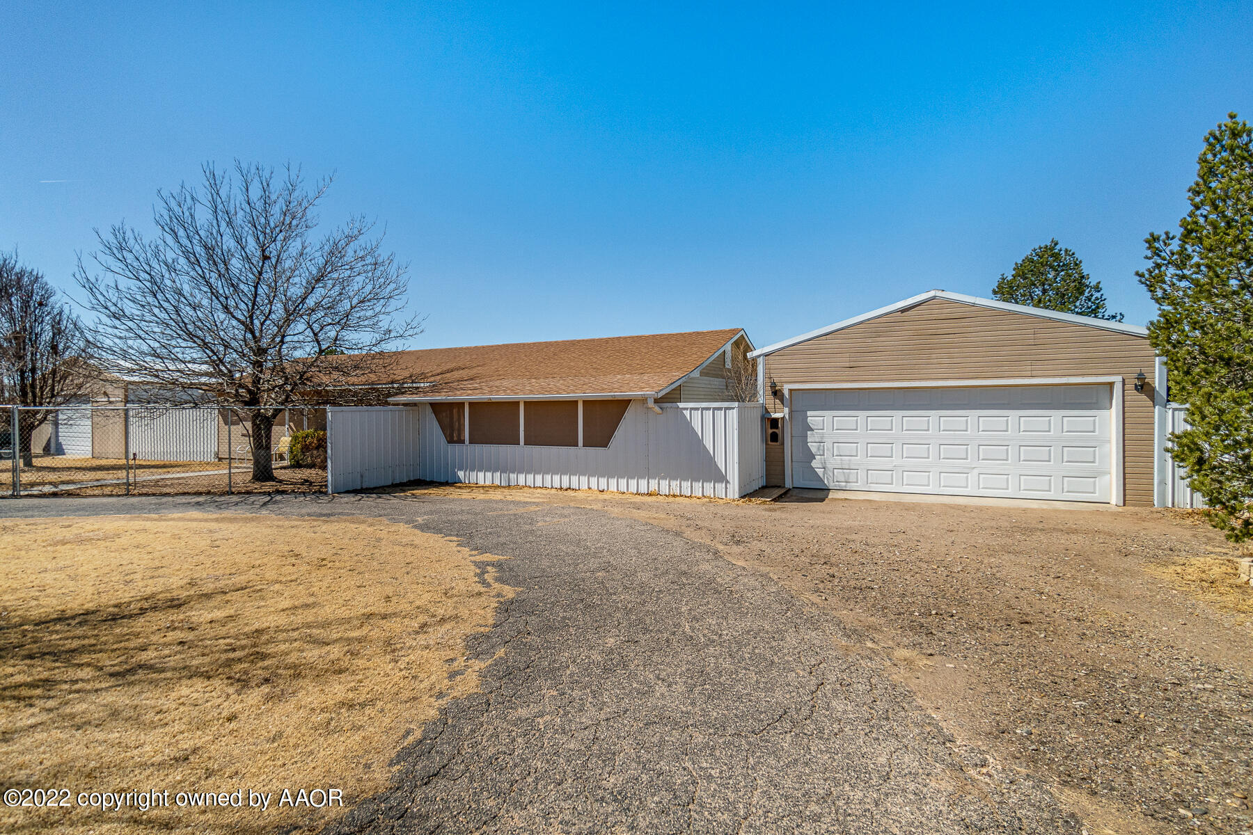 23350 Brown Road Canyon, TX 79015 - Photo 11 of 50 a front view of a house with a yard and garage