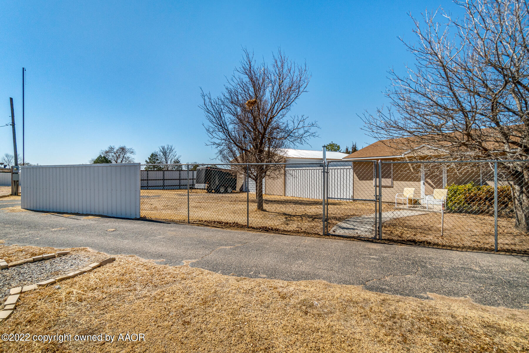 23350 Brown Road Canyon, TX 79015 - Photo 13 of 50 a view of a white house with a road