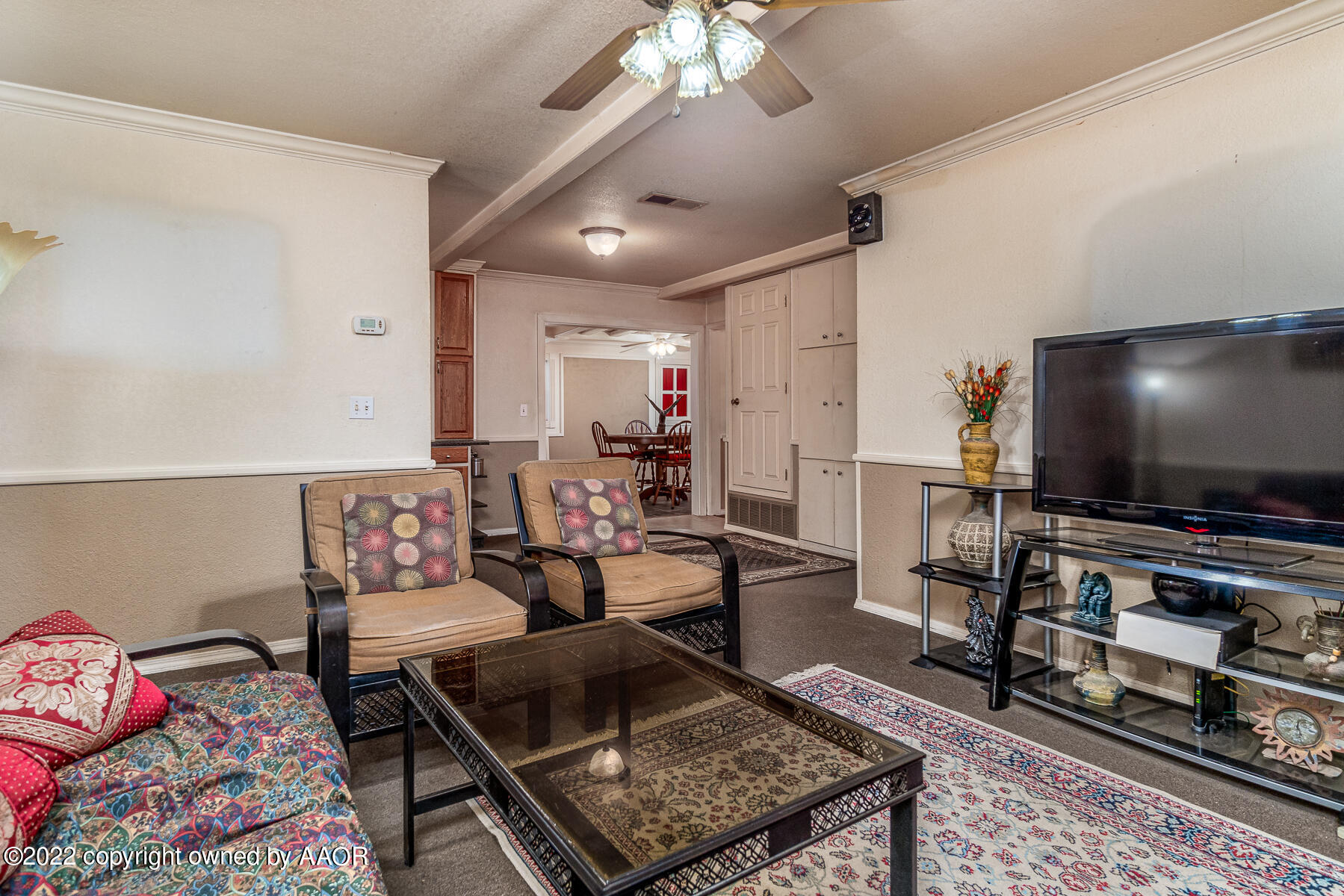 23350 Brown Road Canyon, TX 79015 - Photo 16 of 50 a living room with furniture and a flat screen tv