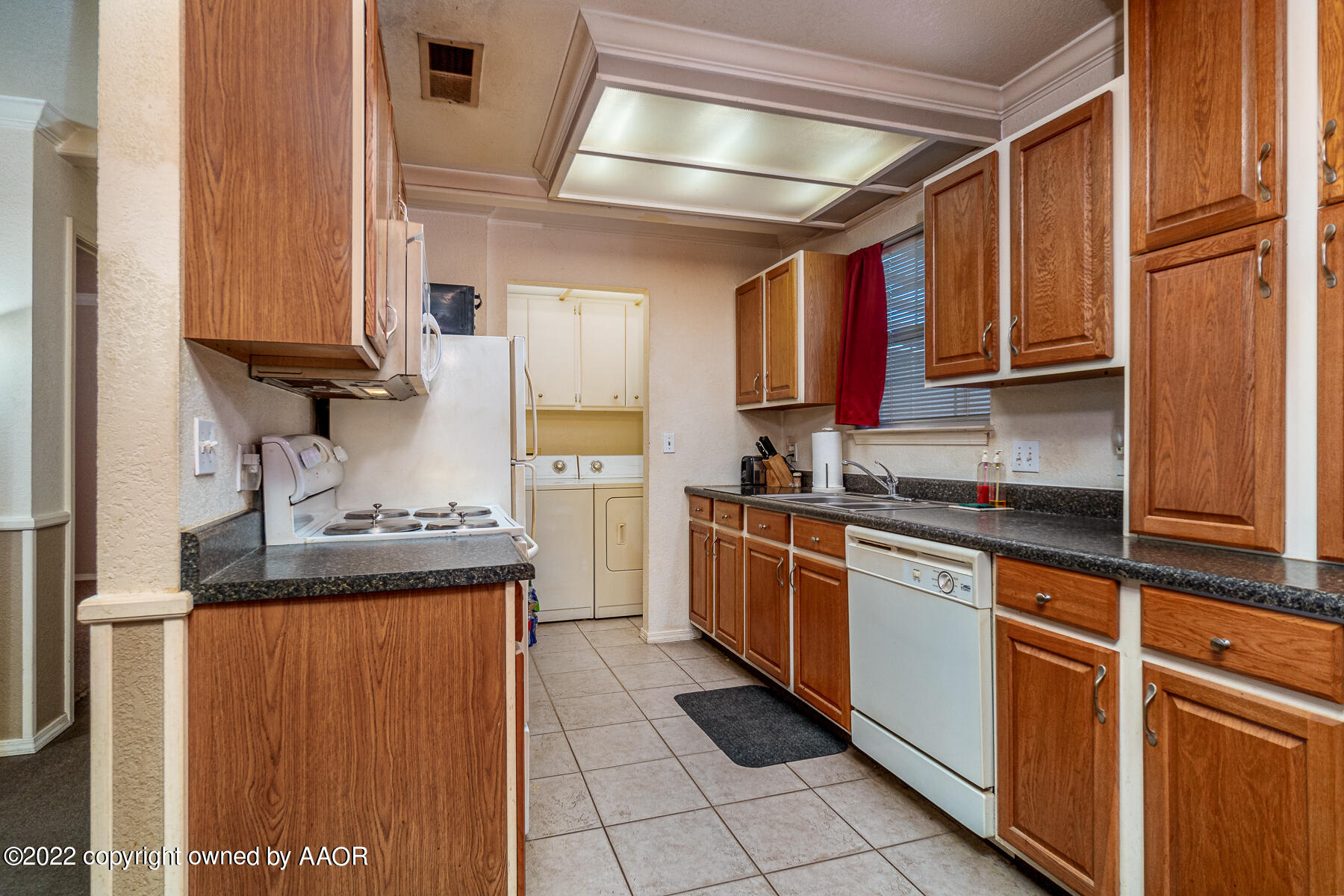 23350 Brown Road Canyon, TX 79015 - Photo 19 of 50 a kitchen with stainless steel appliances granite countertop a sink stove and cabinets