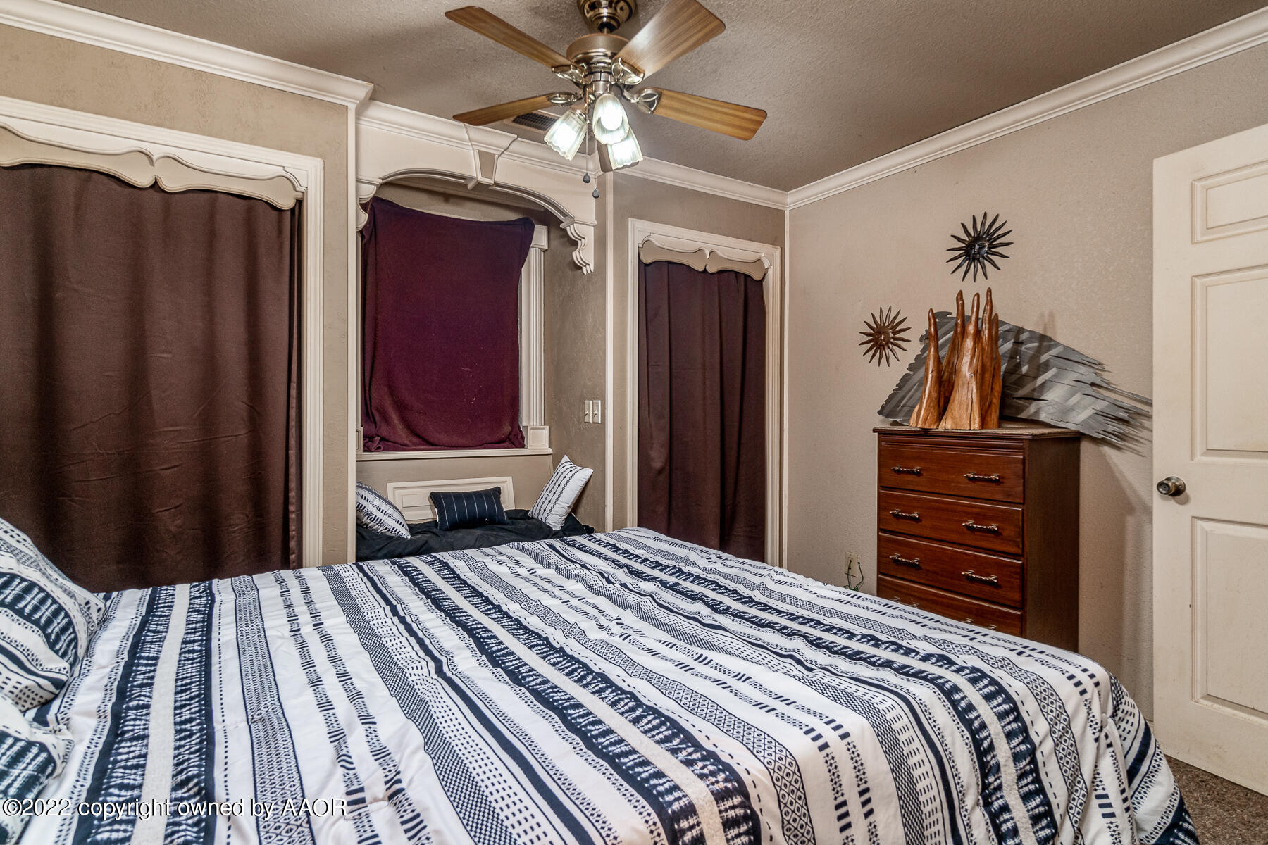 23350 Brown Road Canyon, TX 79015 - Photo 26 of 50 a bedroom with a bed and a mirror