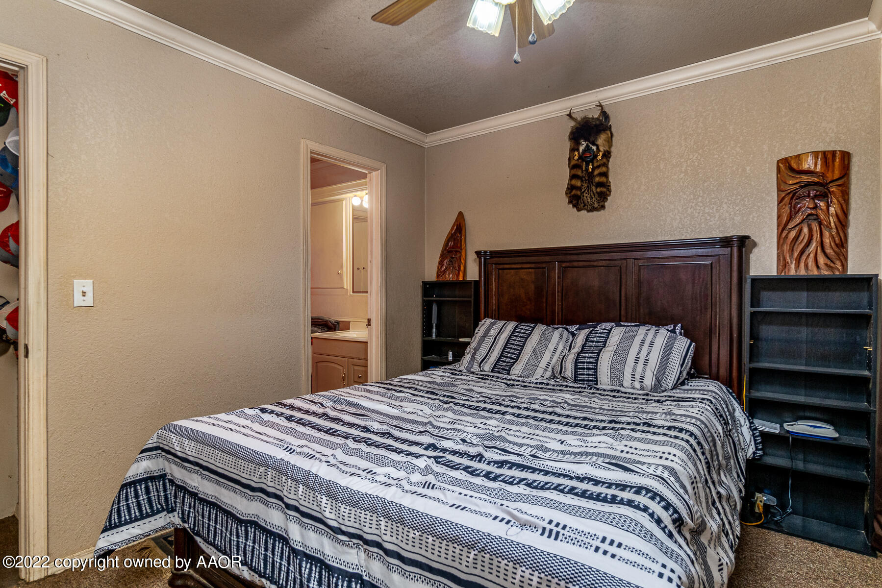 23350 Brown Road Canyon, TX 79015 - Photo 27 of 50 a bedroom with a bed and a chandelier