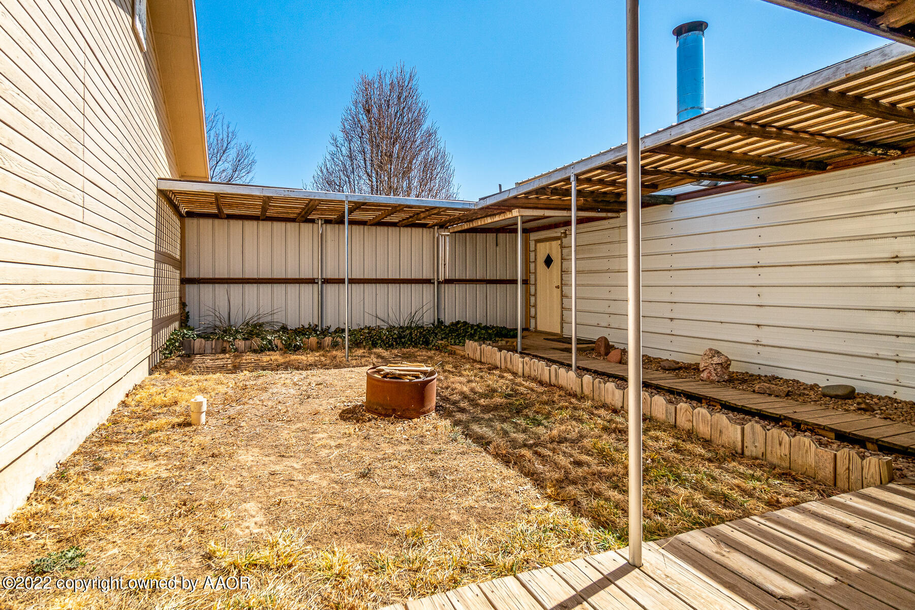 23350 Brown Road Canyon, TX 79015 - Photo 32 of 50 a view of a backyard with chair and wooden floor