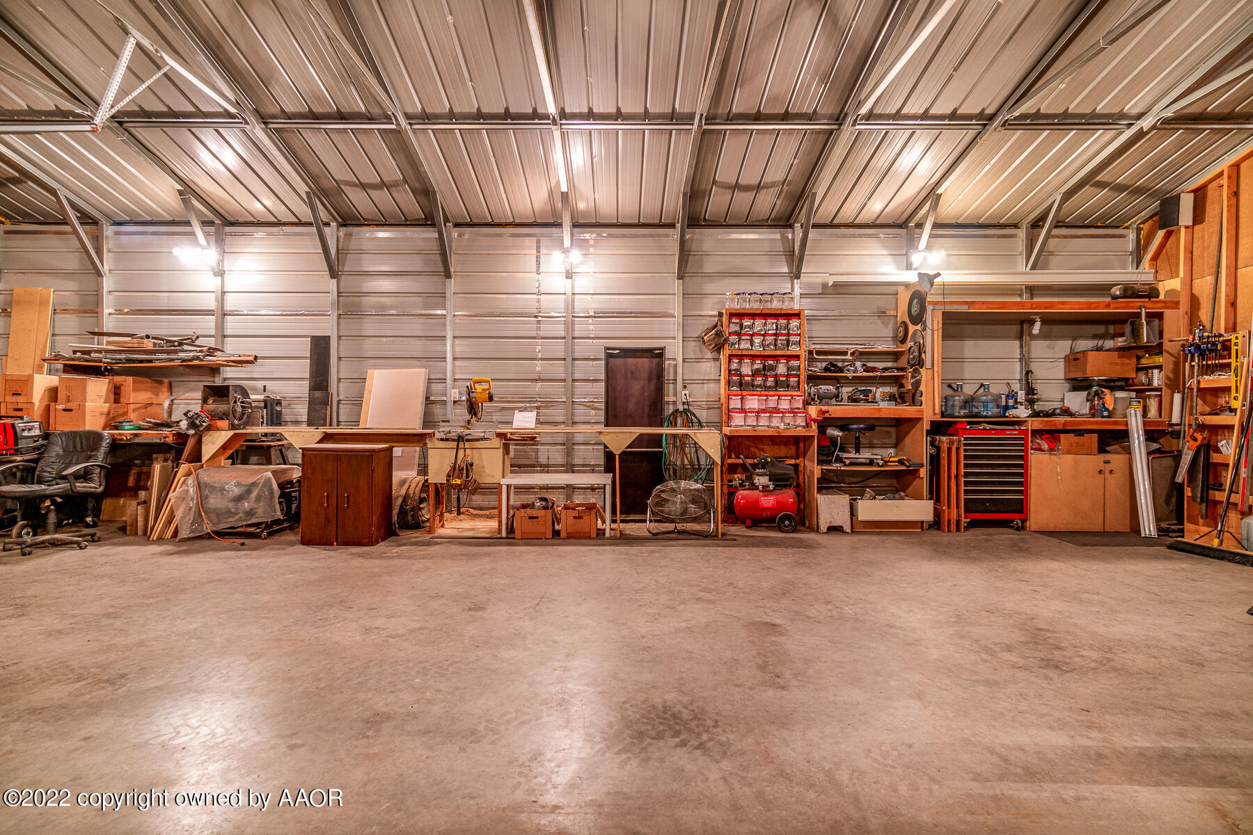 23350 Brown Road Canyon, TX 79015 - Photo 49 of 50 a view of a garage with parked cars