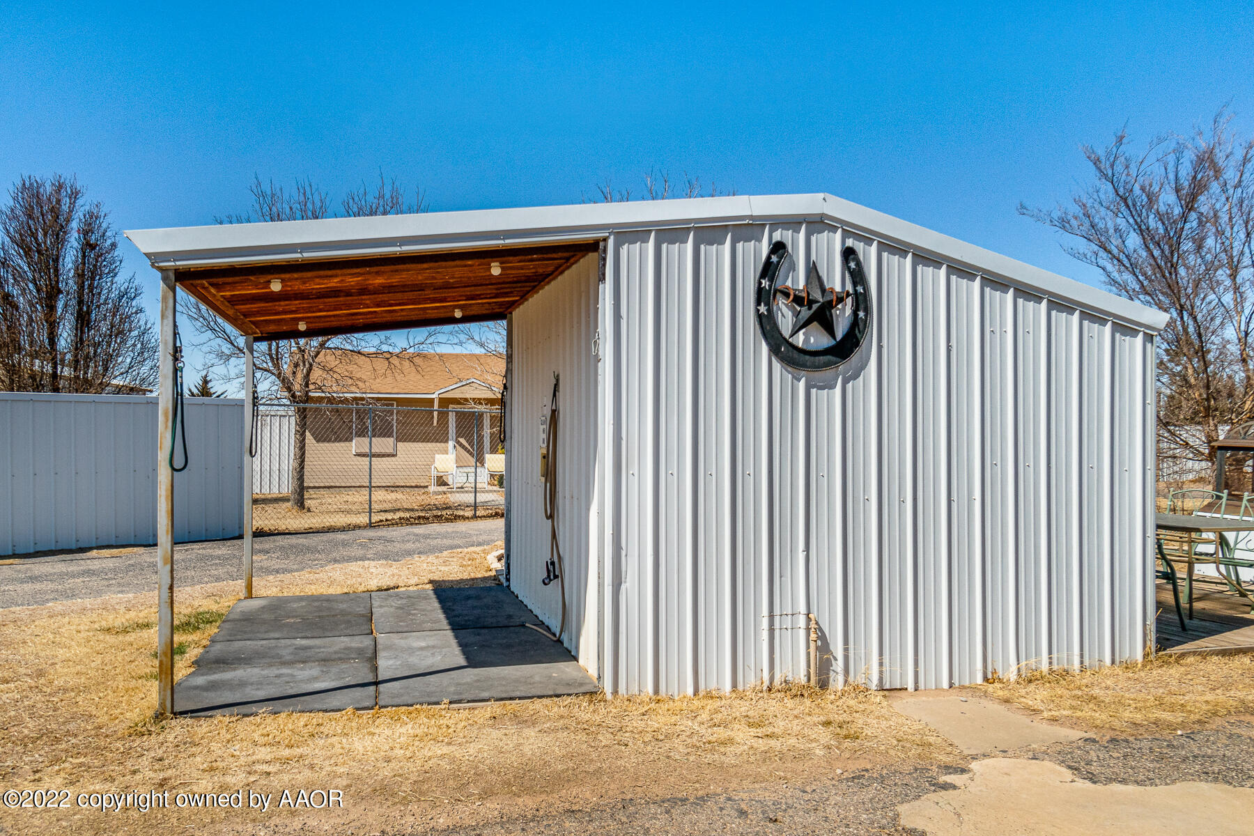 23350 Brown Road Canyon, TX 79015 - Photo 7 of 50 a view of a porch with a hanging tv