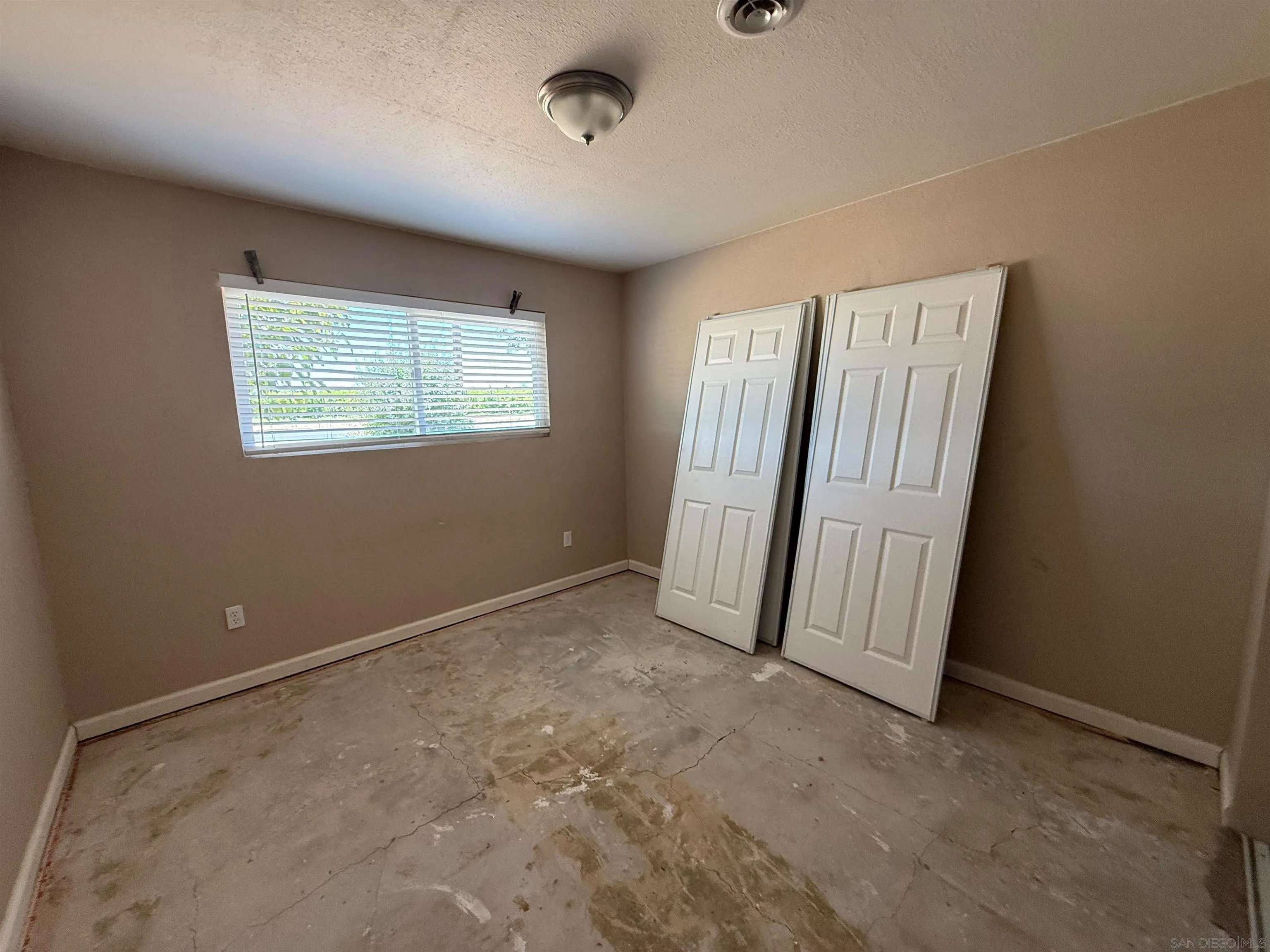 23273 Marsh Creek Road Brentwood, CA 94513 - Photo 2 of 8 an empty room with windows