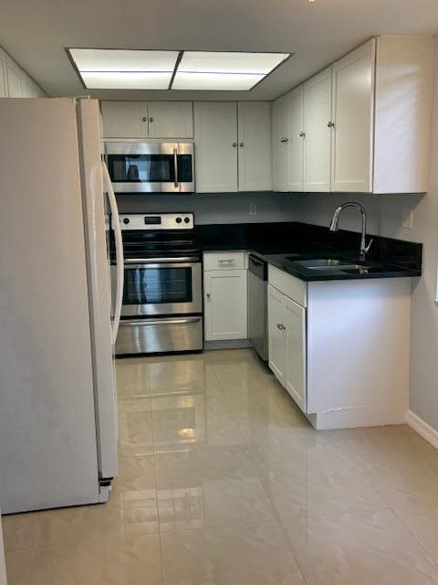 2936 Lake Shore Drive, Unit 101 Riviera Beach, FL 33404 - Photo 4 of 37 IMG_1652