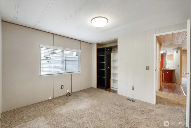 a bathroom with a sink a toilet a mirror and shower