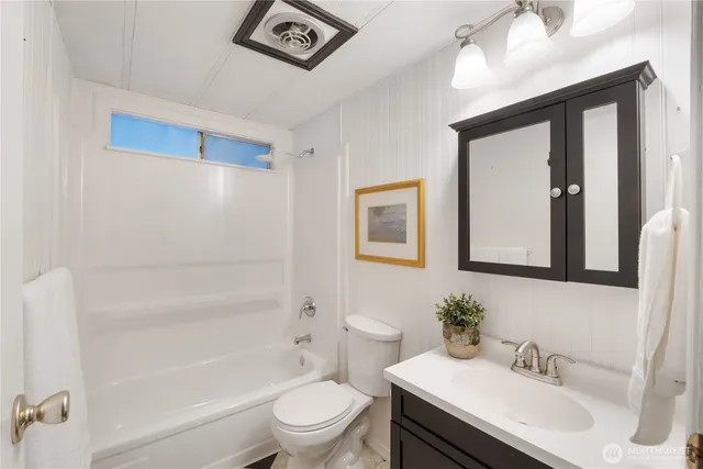 a bed room with a bed and a large window