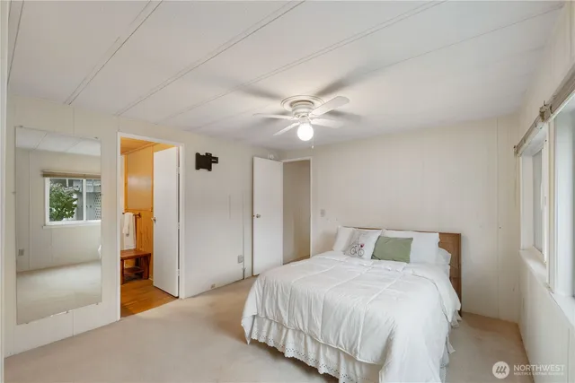 a bathroom with a shower sink and mirror