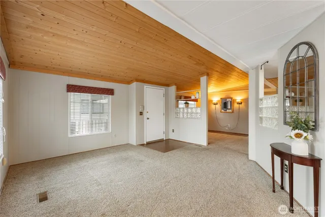 a front view of a house with sitting area and garden