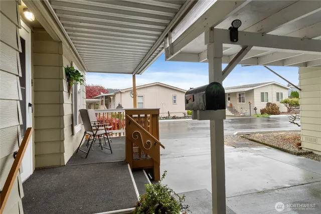 a view of a chairs and table in a backyard