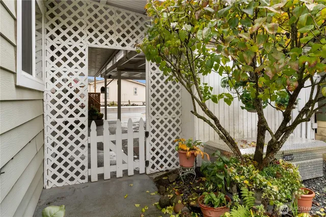 a view of a house with a backyard porch and sitting area
