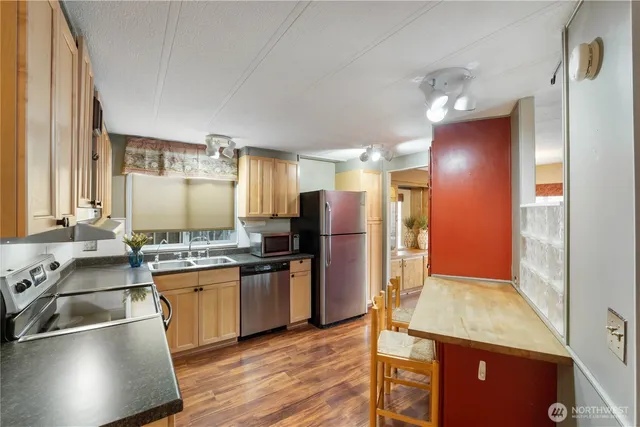 a bedroom with a large bed and a potted plant