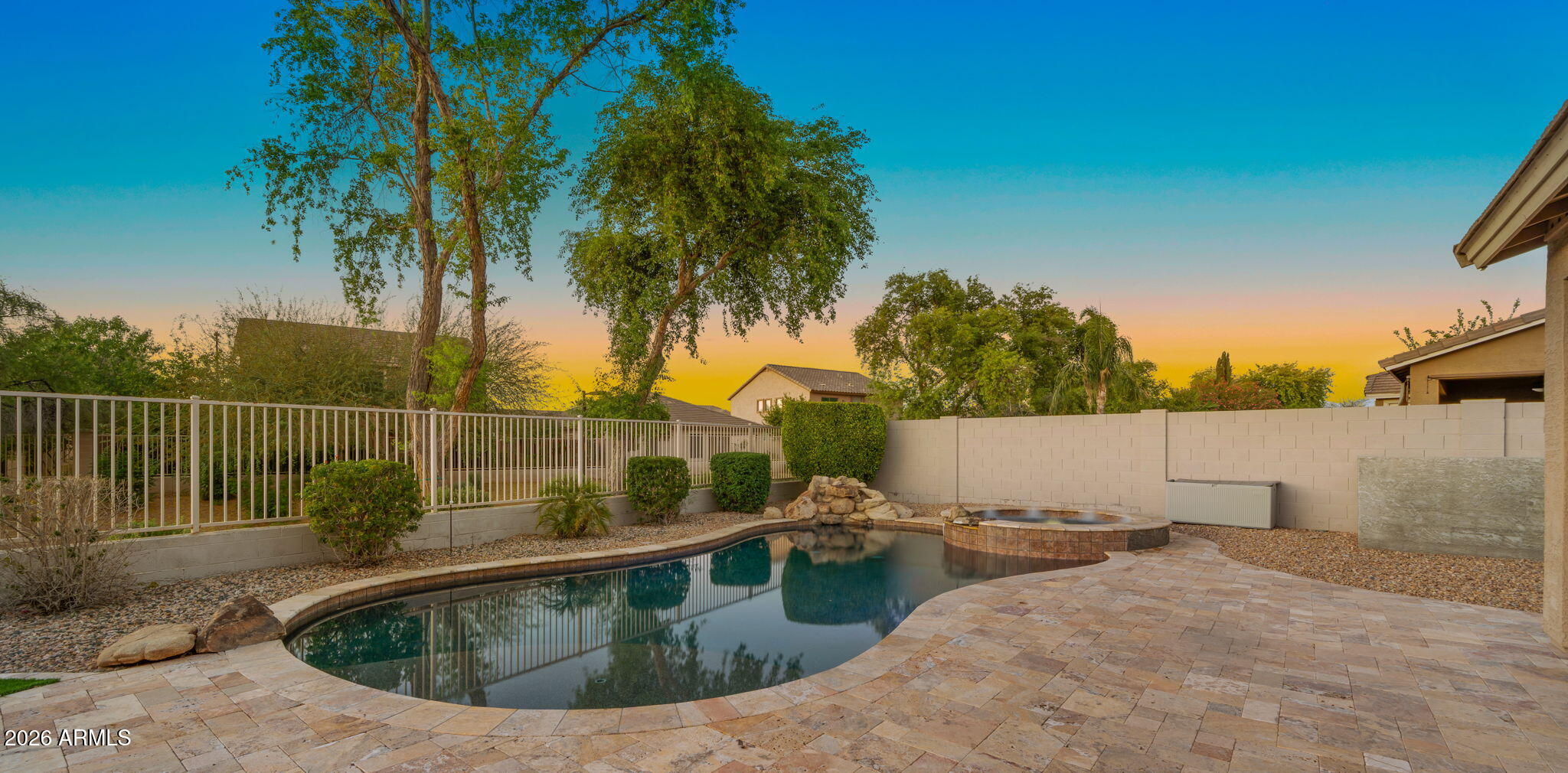 3344 East Hopkins Road Gilbert, AZ 85295 - Photo 23 of 32 a view of a swimming pool with a backyard