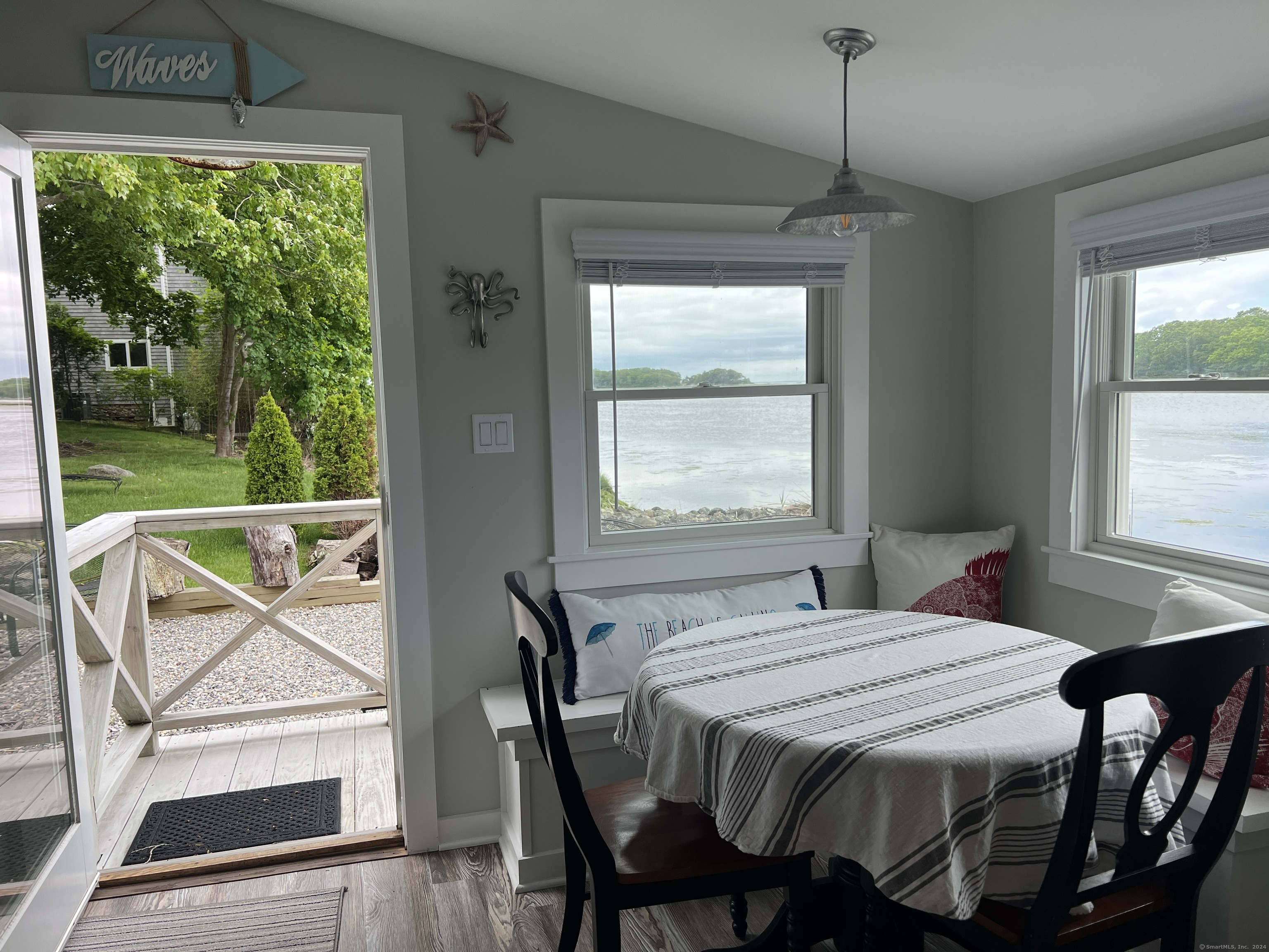 61 Old Black Point Road East Lyme, CT 06357 - Photo 11 of 27 a bedroom with a bed and a window