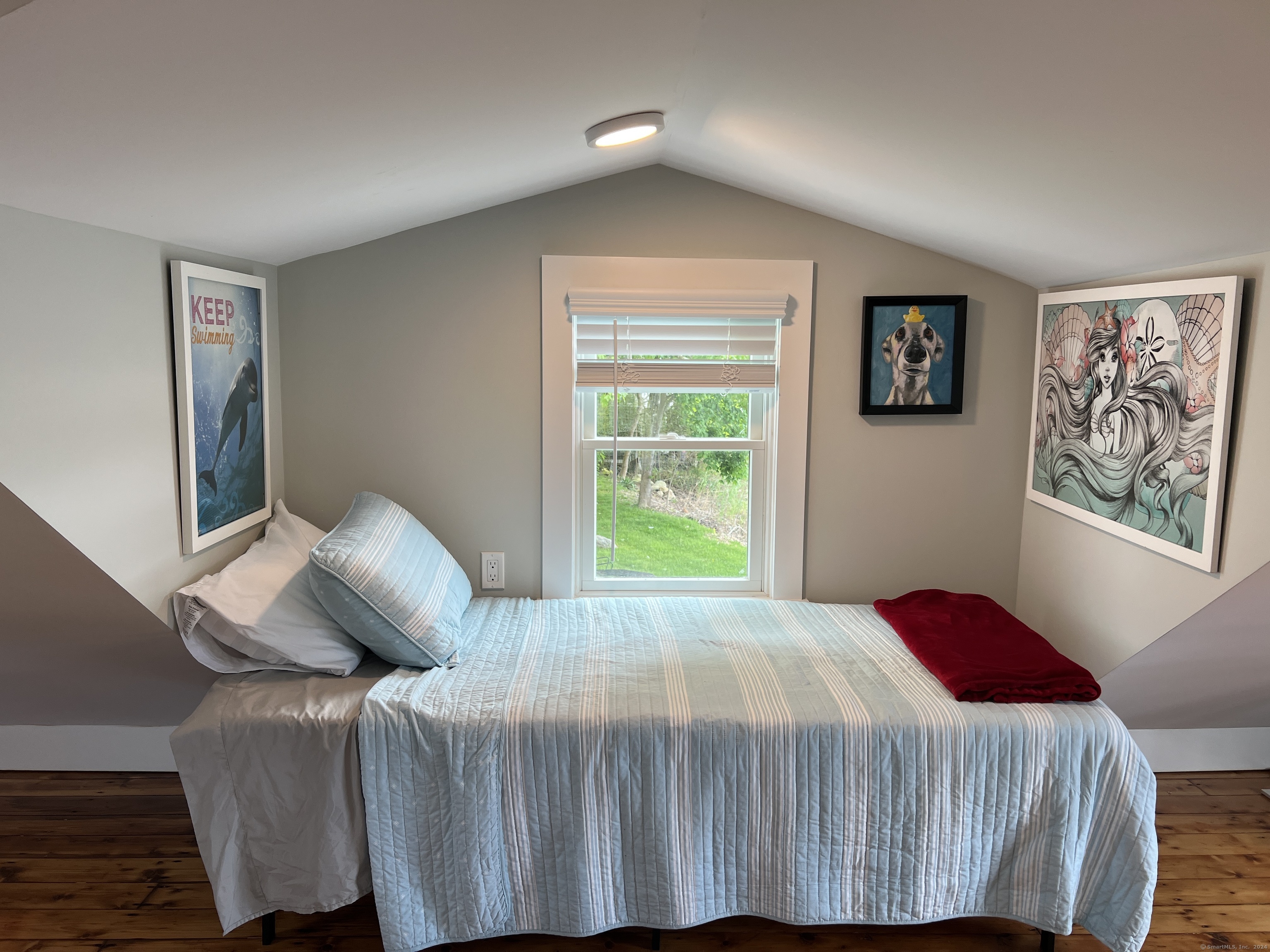 61 Old Black Point Road East Lyme, CT 06357 - Photo 18 of 27 a bedroom with a bed and a window