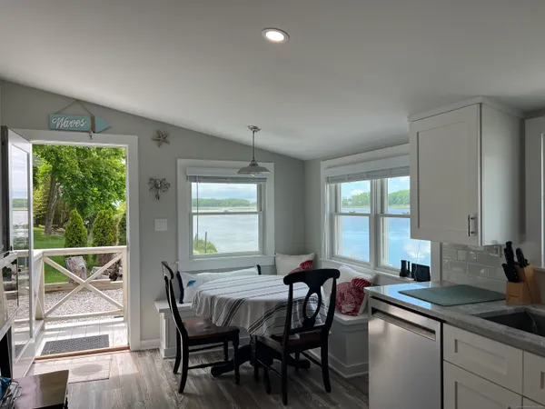 a view of a dining room with furniture window and outside view