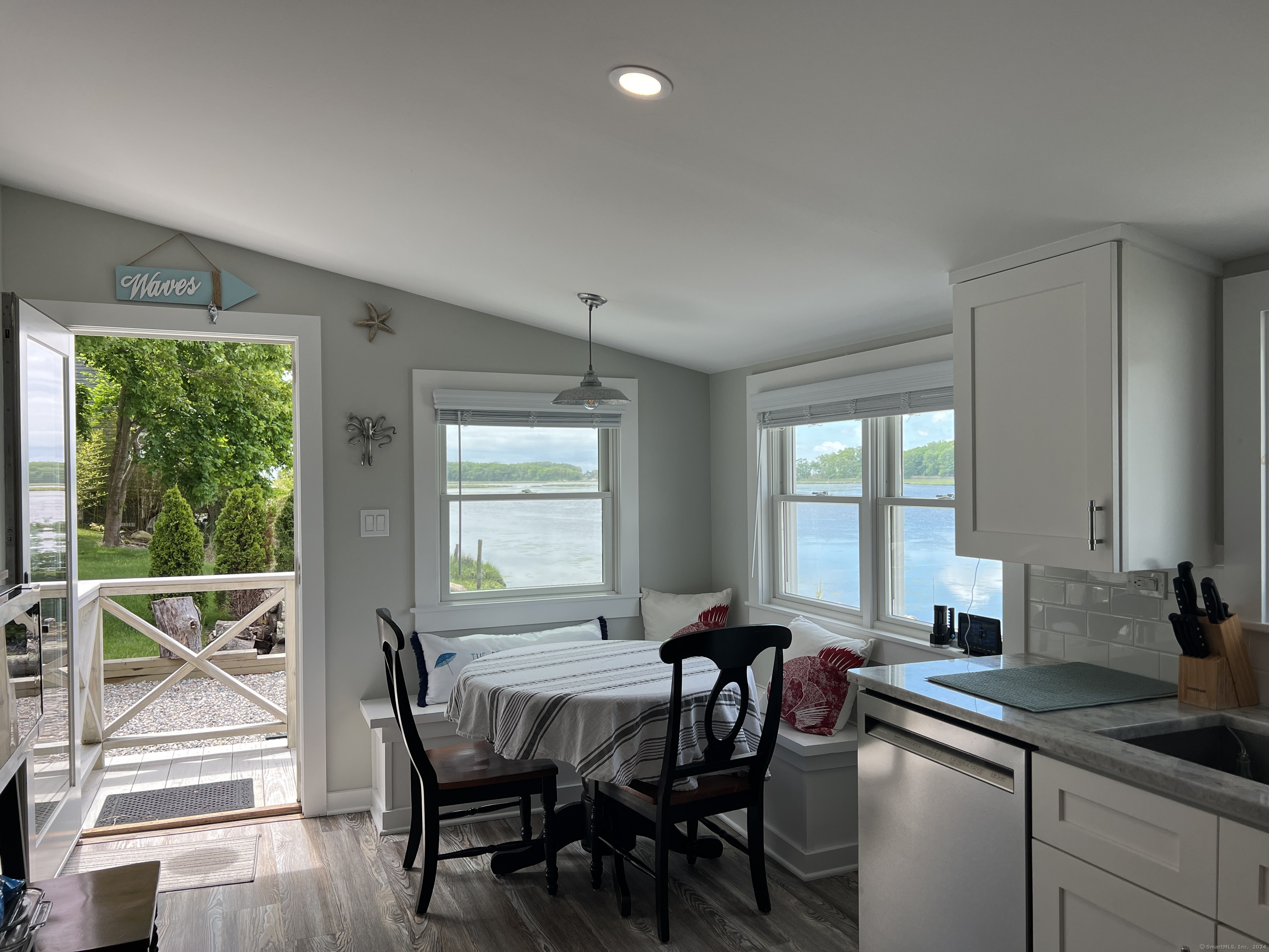 61 Old Black Point Road East Lyme, CT 06357 - Photo 9 of 27 a view of a dining room with furniture window and outside view