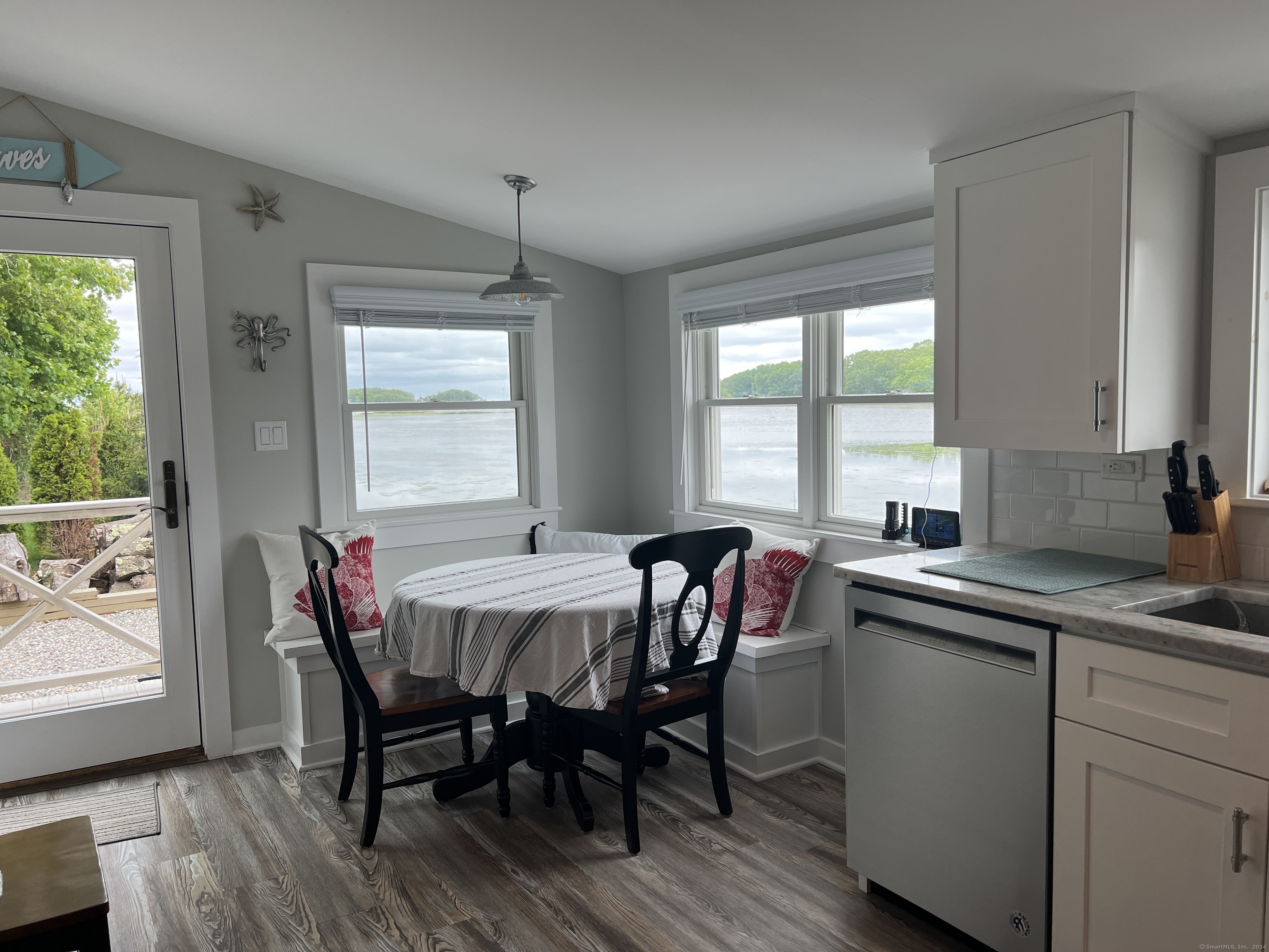 61 Old Black Point Road East Lyme, CT 06357 - Photo 10 of 27 a view of a dining room with furniture and window