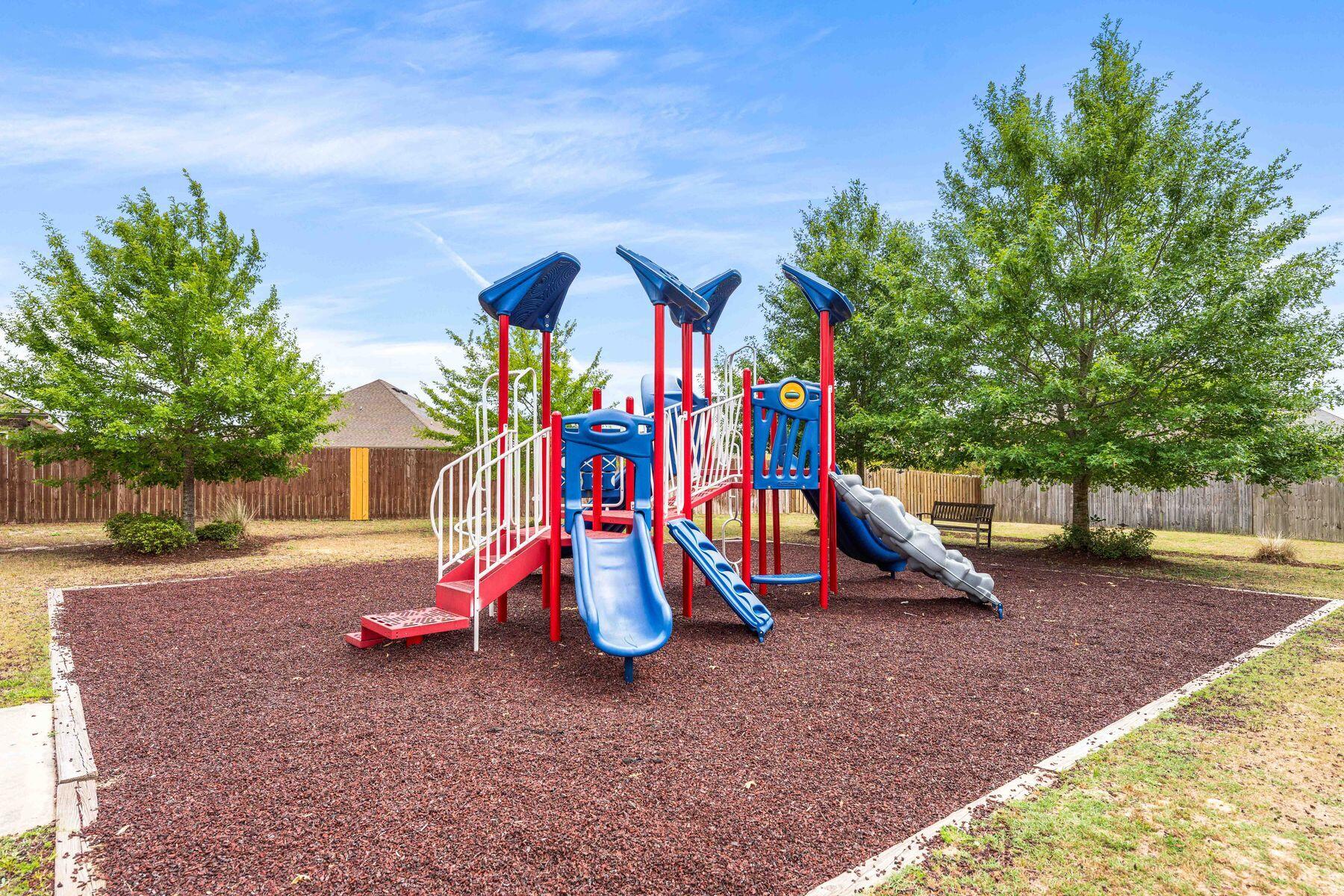 656 Teal Street Crestview, FL 32539 - Photo 15 of 58 a view of outdoor space with playground and green space
