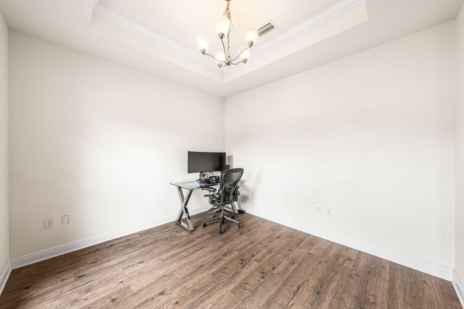 656 Teal Street Crestview, FL 32539 - Photo 21 of 58 a workspace with wooden floor and a workspace