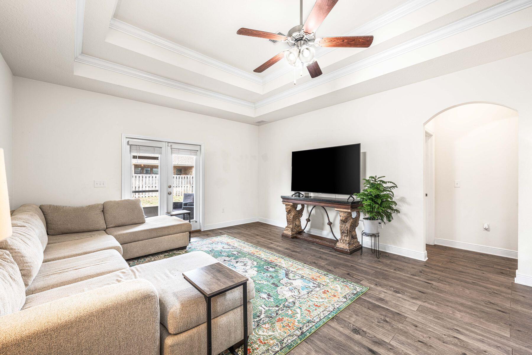 656 Teal Street Crestview, FL 32539 - Photo 28 of 58 a living room with furniture and a flat screen tv