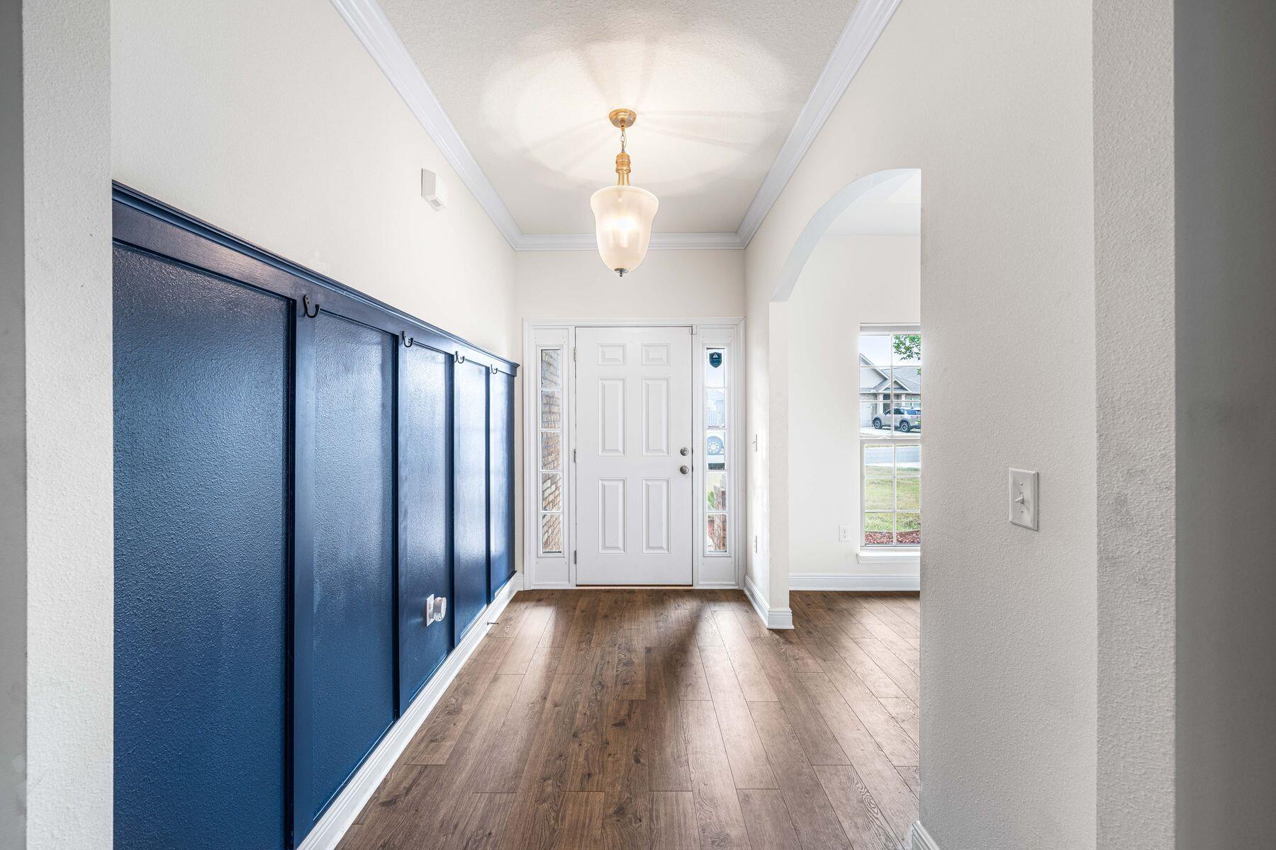 656 Teal Street Crestview, FL 32539 - Photo 3 of 58 a view of a hallway with wooden floor