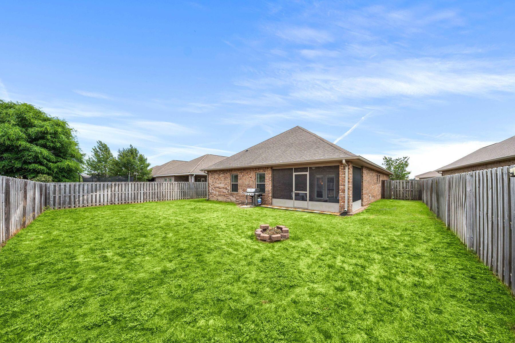 656 Teal Street Crestview, FL 32539 - Photo 39 of 58 a view of a house with backyard and garden