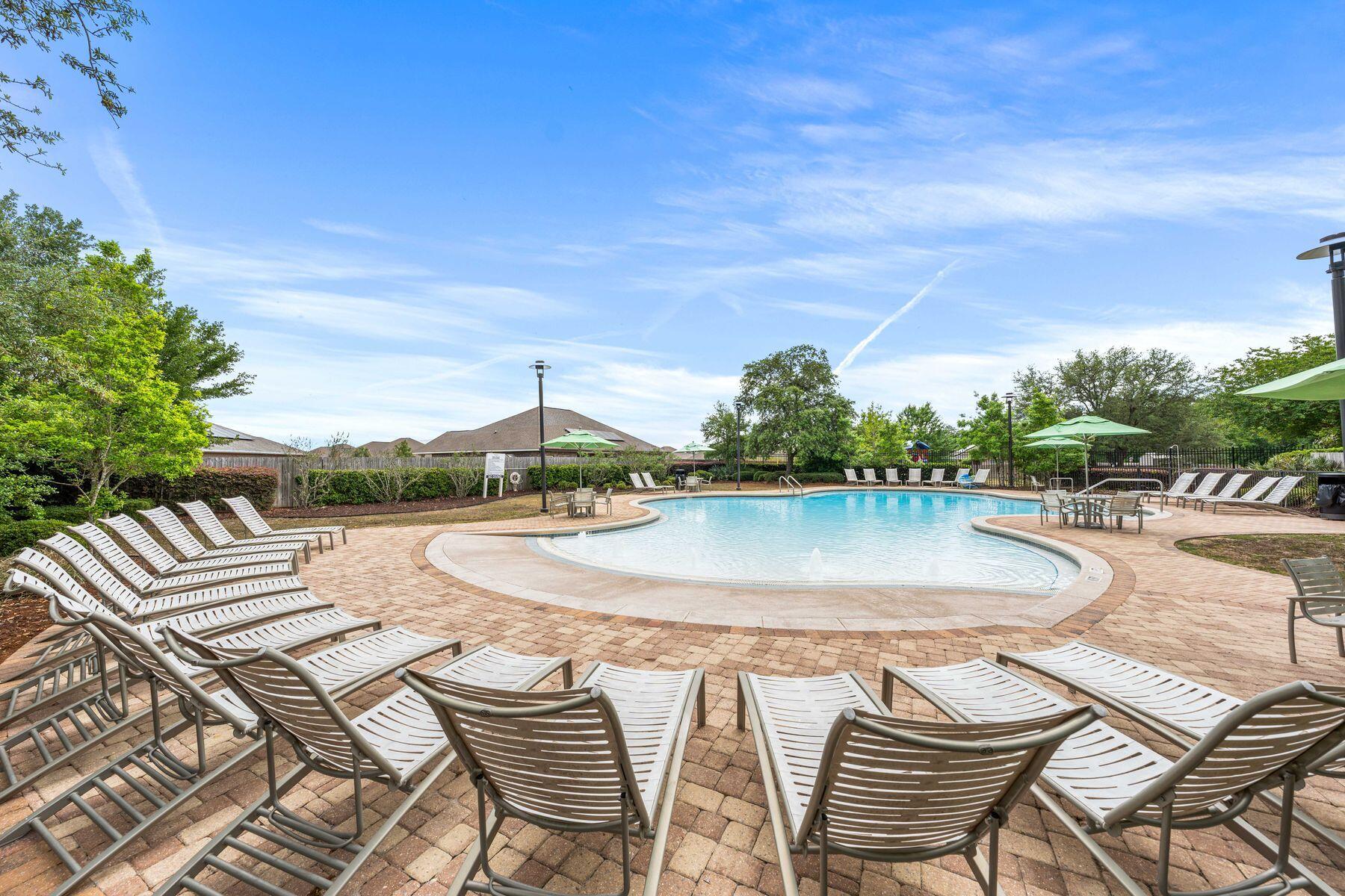 656 Teal Street Crestview, FL 32539 - Photo 47 of 58 a view of a swimming pool with a patio