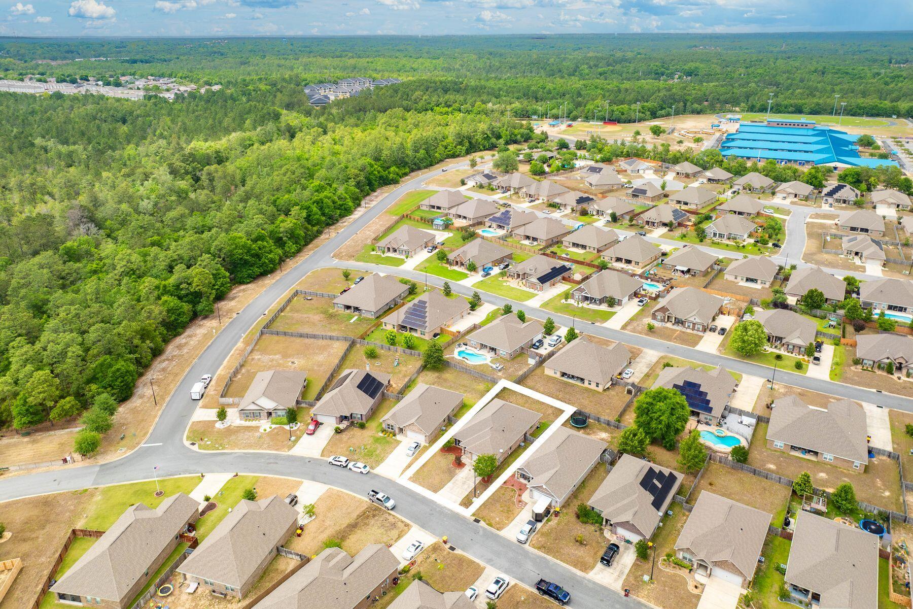 656 Teal Street Crestview, FL 32539 - Photo 55 of 58 a view of a lake with a yard