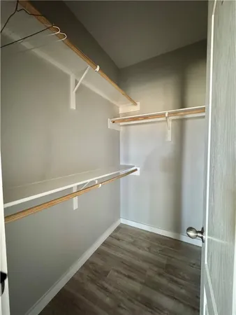 a view of an empty walk in closet