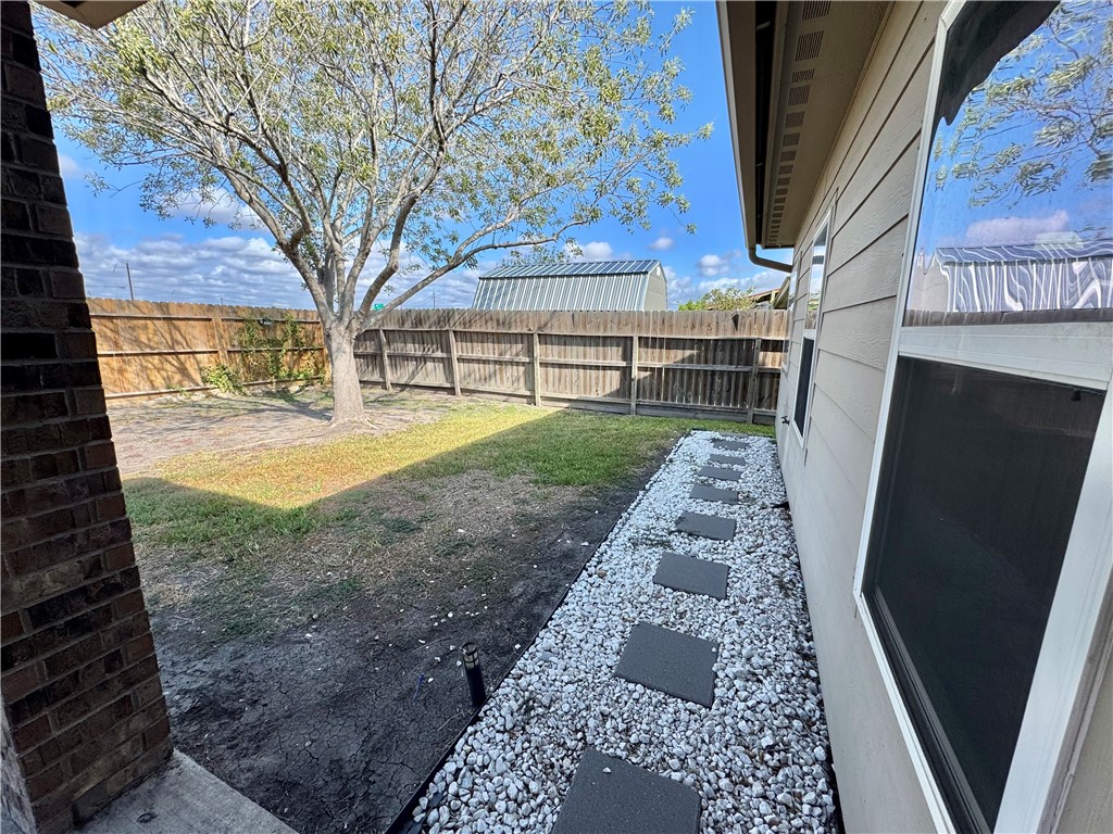 322 Pacific Drive Portland, TX 78374 - Photo 20 of 22 a view of a backyard with pathway