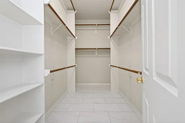 a view of staircase with white walls