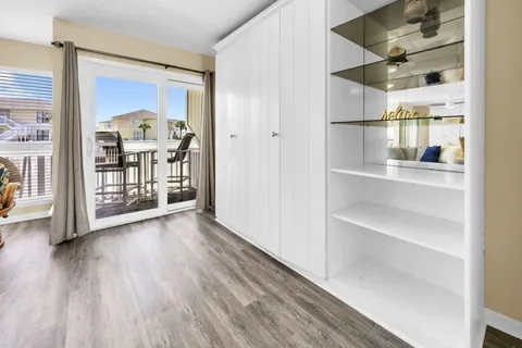 a kitchen with stainless steel appliances granite countertop table chairs sink and cabinets
