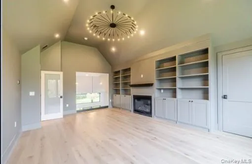 a view of a livingroom with a furniture wooden floor and window