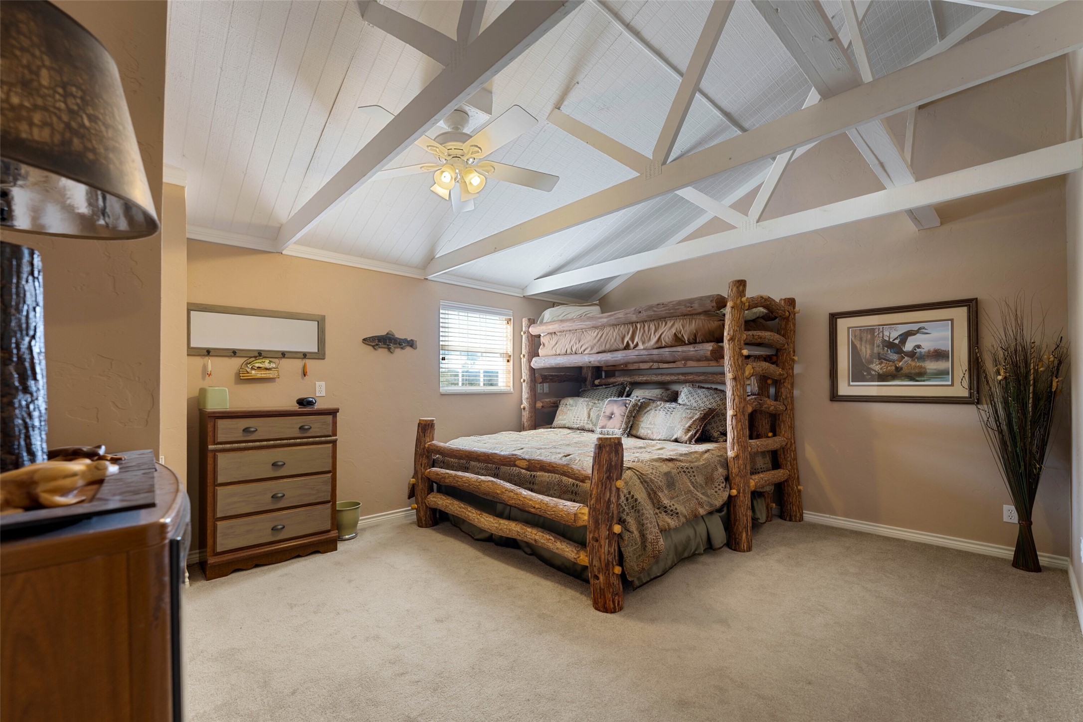 7702 Ranch Road 965 Llano, TX 78643 - Photo 19 of 40 a bedroom with a bed and a walk in closet