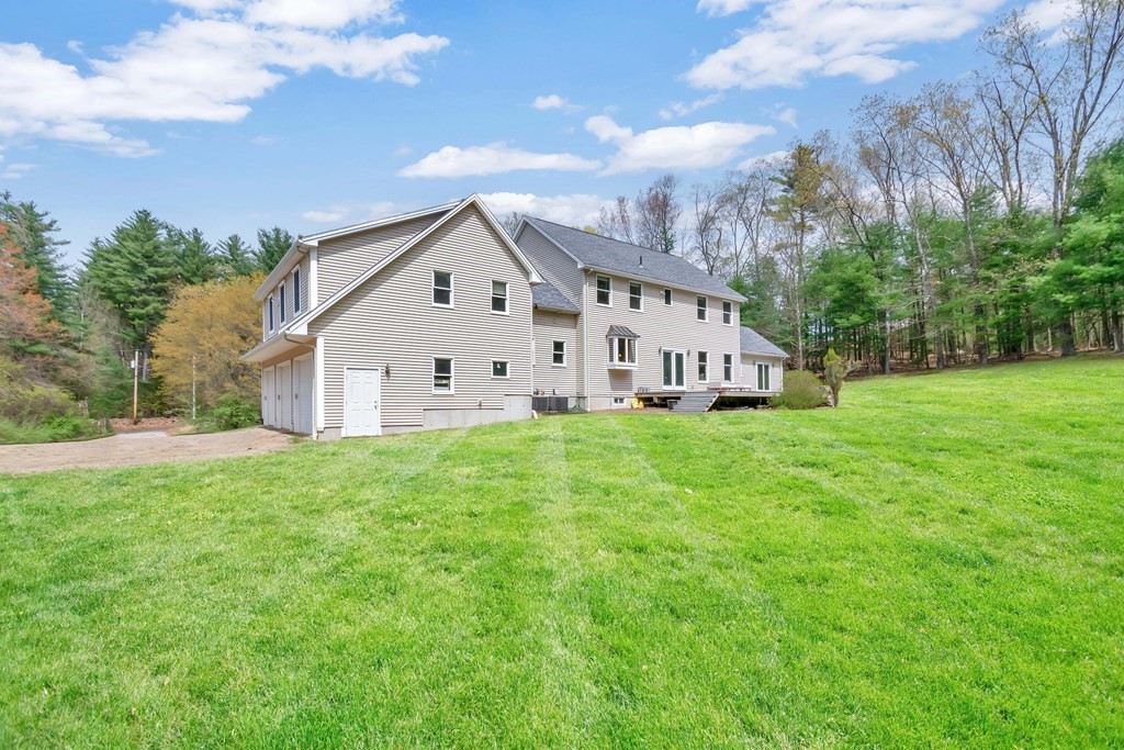 11 Maxwell Road Monson, MA 01057 - Photo 2 of 41 a view of a house with backyard and garden