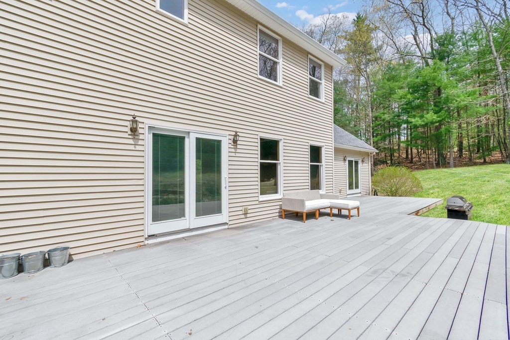 11 Maxwell Road Monson, MA 01057 - Photo 39 of 41 a view of a house with wooden deck and sitting area