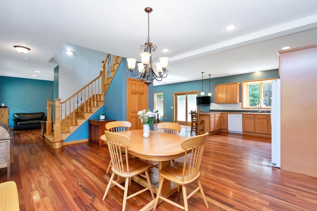 11 Maxwell Road Monson, MA 01057 - Photo 4 of 41 a view of a dining room and livingroom with furniture wooden floor a chandelier