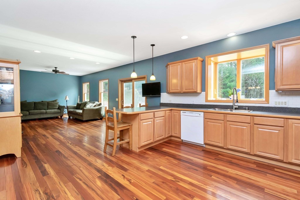 11 Maxwell Road Monson, MA 01057 - Photo 8 of 41 a large kitchen with a lot of counter space and a wooden floor