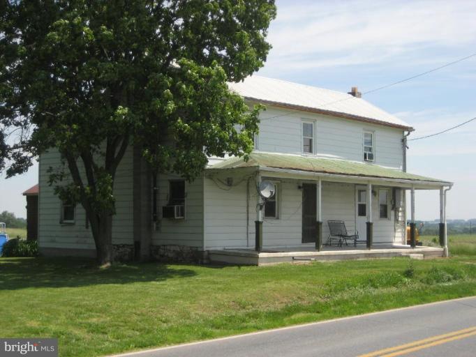 12250 Good Intent Road Keymar, MD 21757 - Photo 1 of 2 a view of a white house with a big yard and potted plants