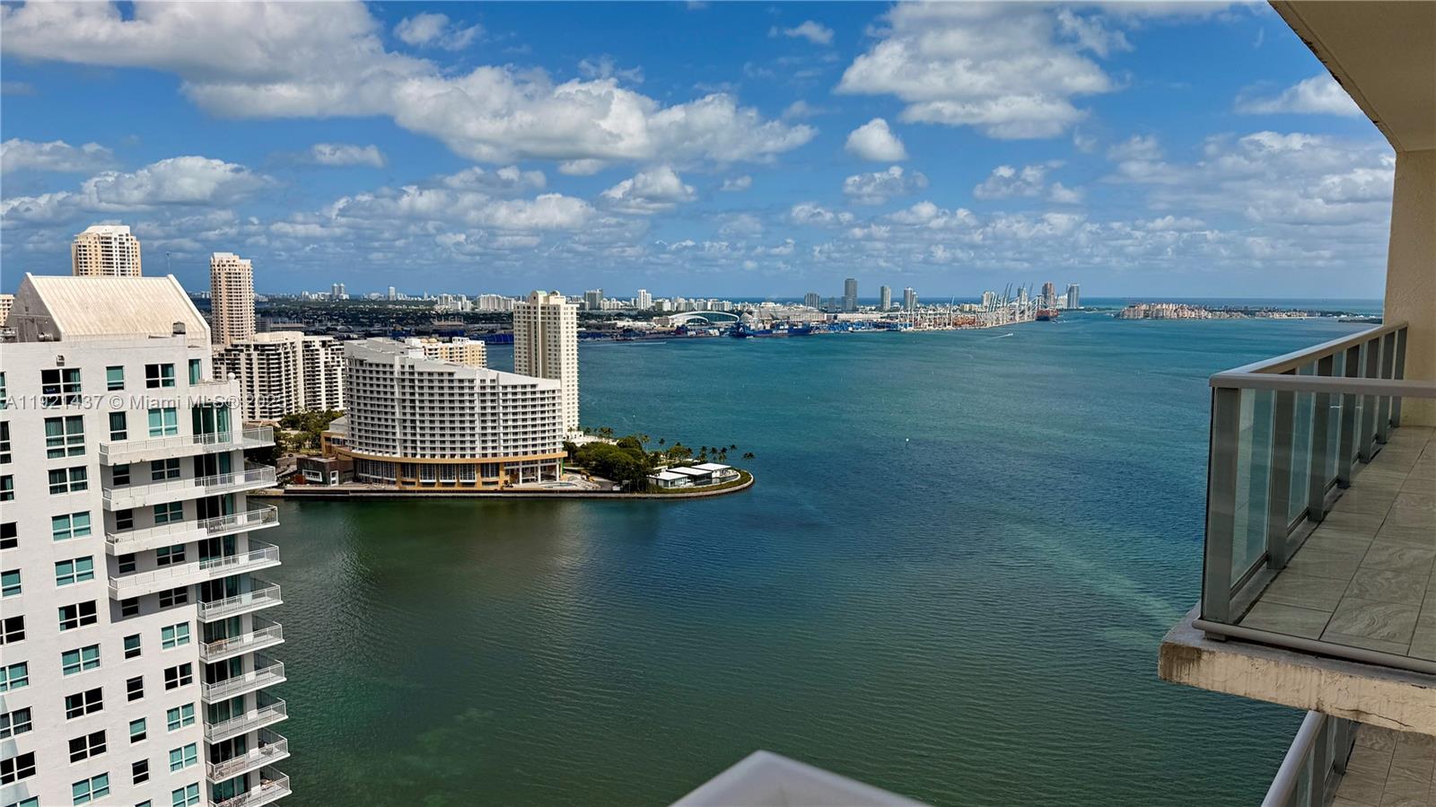 1155 Brickell Bay Drive, Unit PH104 Miami, FL 33131 - Photo 1 of 35 a view of a lake with building in front of it
