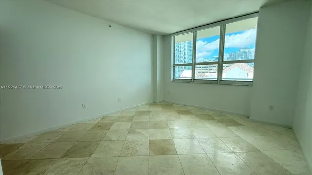 a view of an empty room with a window