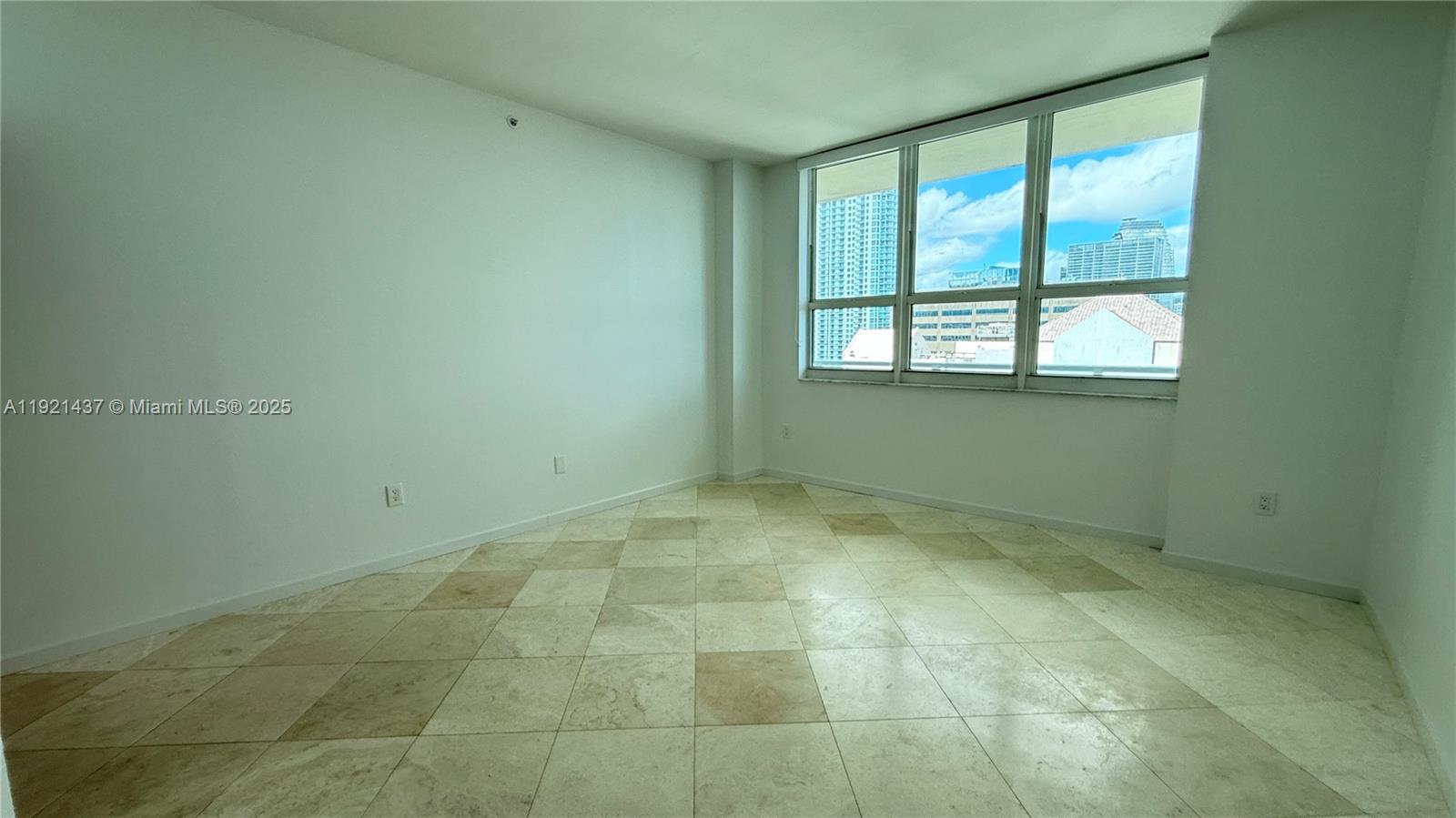 1155 Brickell Bay Drive, Unit PH104 Miami, FL 33131 - Photo 15 of 35 a view of an empty room with a window